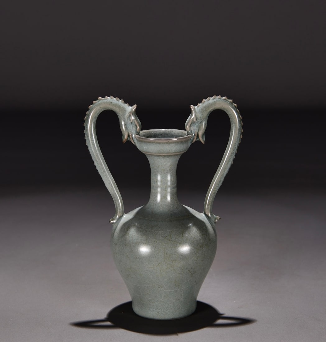 Formerly in the collection of a Song Dynasty Ru ware celadon double dragon vase: Song Dynasty Ru ware celadon vase with two dragons, formerly in my collection! Dimensions: Height 17cm, Width 12cm. Provenance:Private collection, Hamburg, Germany. Our cooperative logistics services