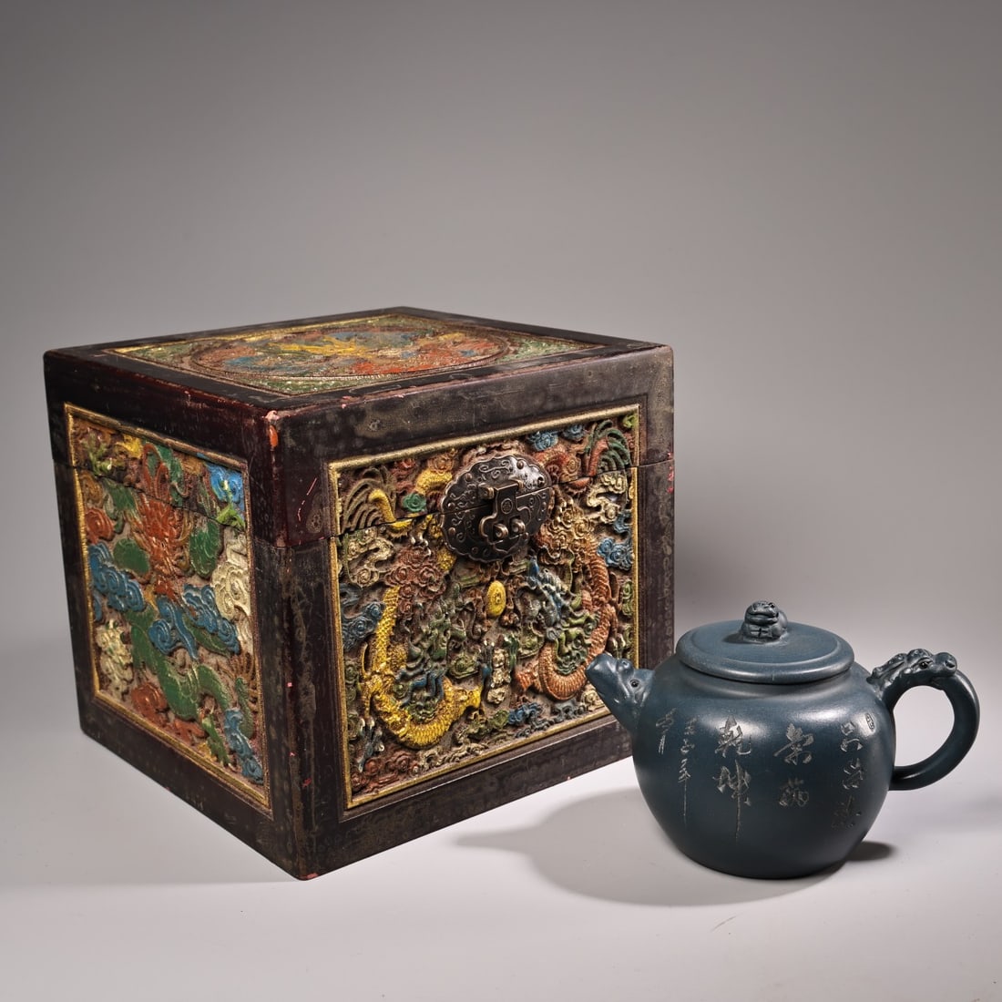 A pure handmade original ore sky blue purple clay teapot: A pure handmade, original ore celadon teapot, exquisitely crafted, beautifully shaped, and comes with a carved wooden box. It weighs 270 grams, is 11 cm high, and 14 cm wide. Provenance:Private collec