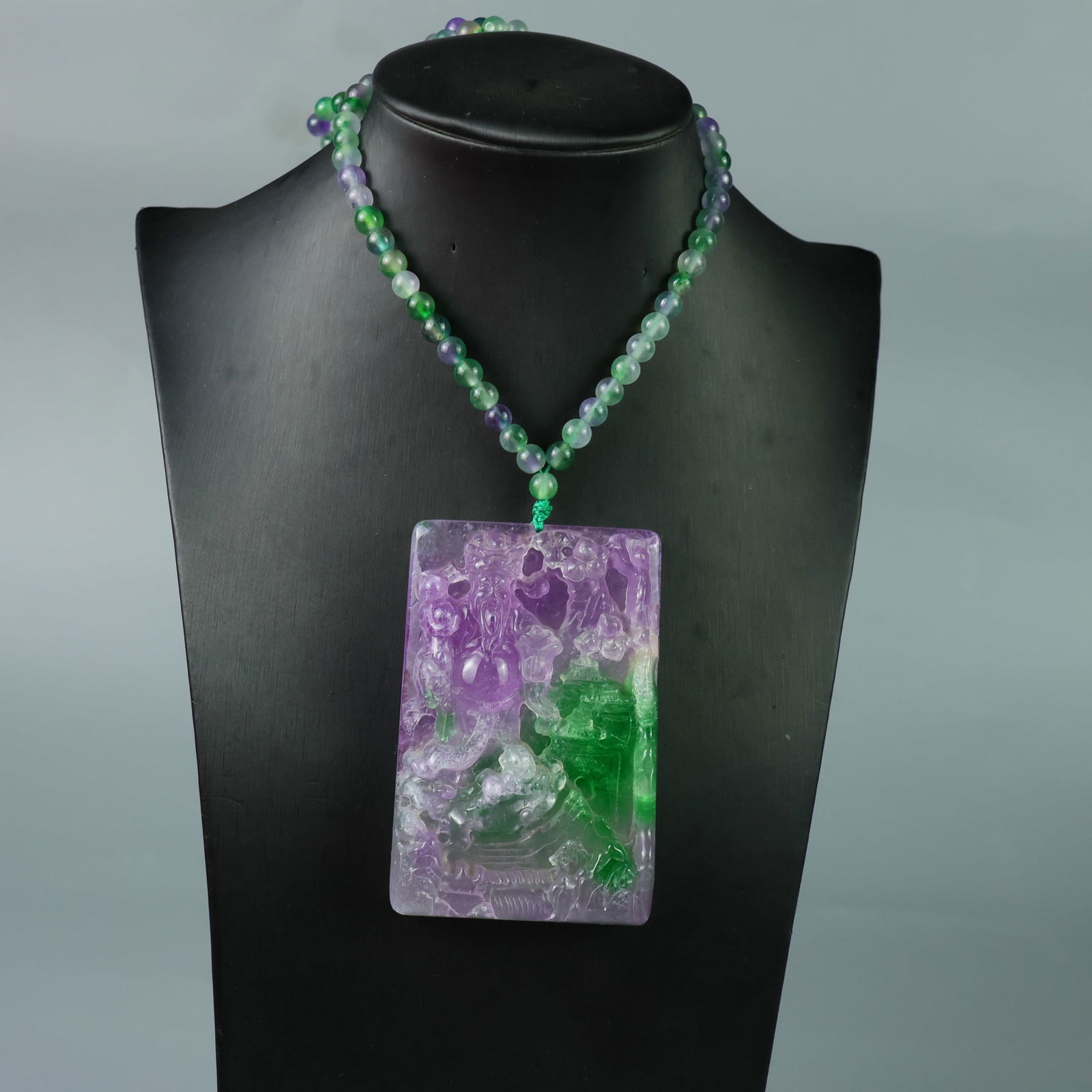 Perfectly crafted high-quality ice crystal carving of the God of Wealth.: This exquisitely carved God of Wealth pendant is made of high-grade icy jadeite. The base is pure, rich, clean, and translucent with a strong fluorescent effect and excellent rigidity. It is a true ic