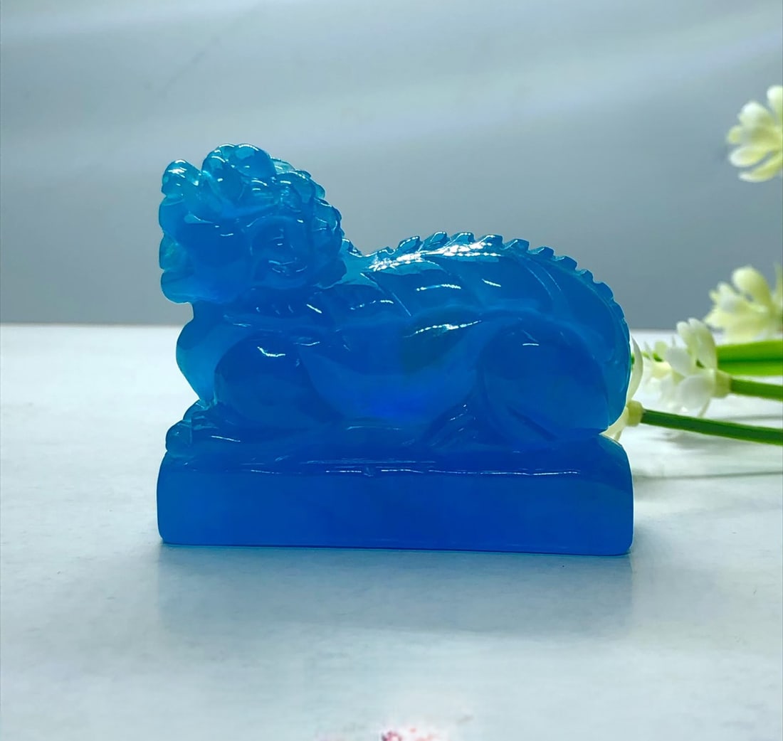 Dragon Stone High-Ice High-Fluorescence Ocean Blue Jadeite Auspicious Beast Seal Ornament: This is a high-quality, highly fluorescent ocean blue jadeite seal with a mythical beast design. It is a fully carved piece made from superior material, exhibiting excellent translucency and clarity.