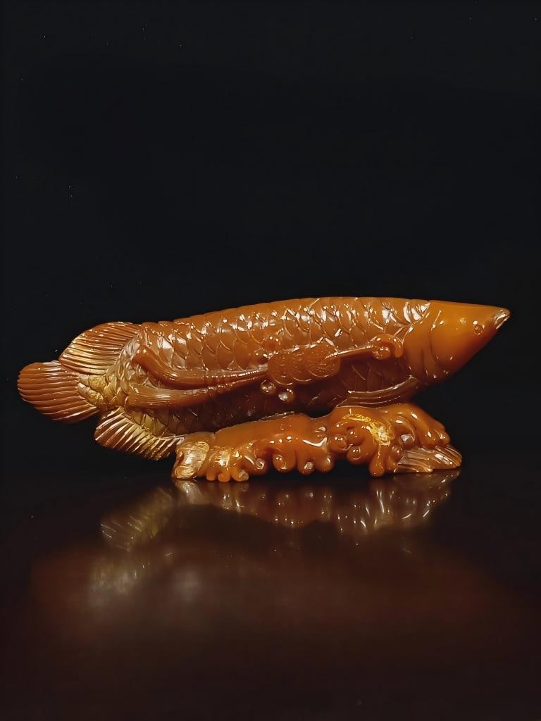 Tianhuang stone gold-painted fish ornament: Fine Tianhuang stone gold-painted fish ornament: 12 x 33 cm, 2015 g Provenance:Private collection, Lisbon, Portugal. Our cooperative logistics services provider expertly handles both domestic and glob