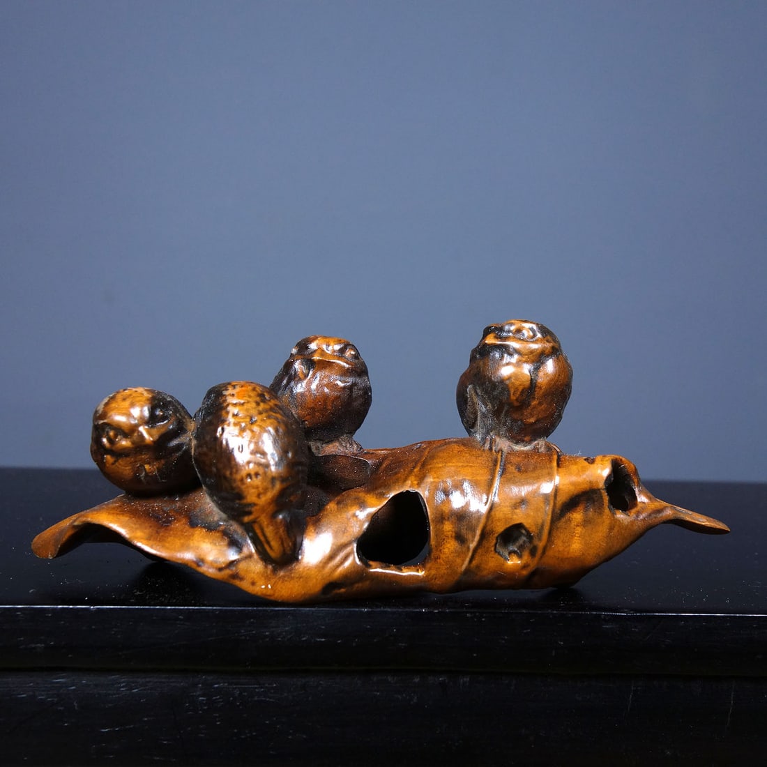An old boxwood pen holder, exquisitely carved with the motif of "Peace and Prosperity".: An old boxwood pen holder, exquisitely carved with the motif of "Peace and Prosperity". Dimensions: Length 11.5cm, Width 3cm, Height 5cm. Weight: 35g. Provenance:Private collection in Geneva, Switzerl