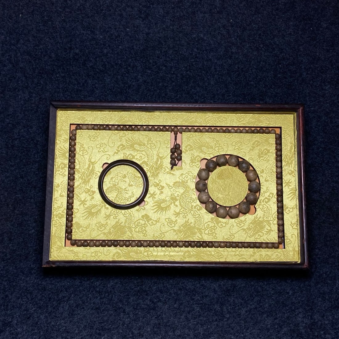 The rosewood box inlaid with mother-of-pearl contains agarwood prayer beads, agarwood bracelets, and (1 of 12)