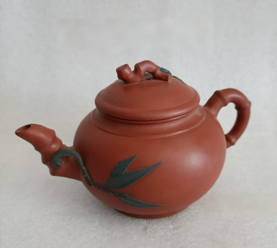 I collected an old Yixing teapot from the countryside.: An old Yixing teapot collected from the countryside, well-preserved, with exquisite carving; dimensions: 17 x 11 cm. Provenance:Private collection from a professor in Paris-Saclay University. Our coop