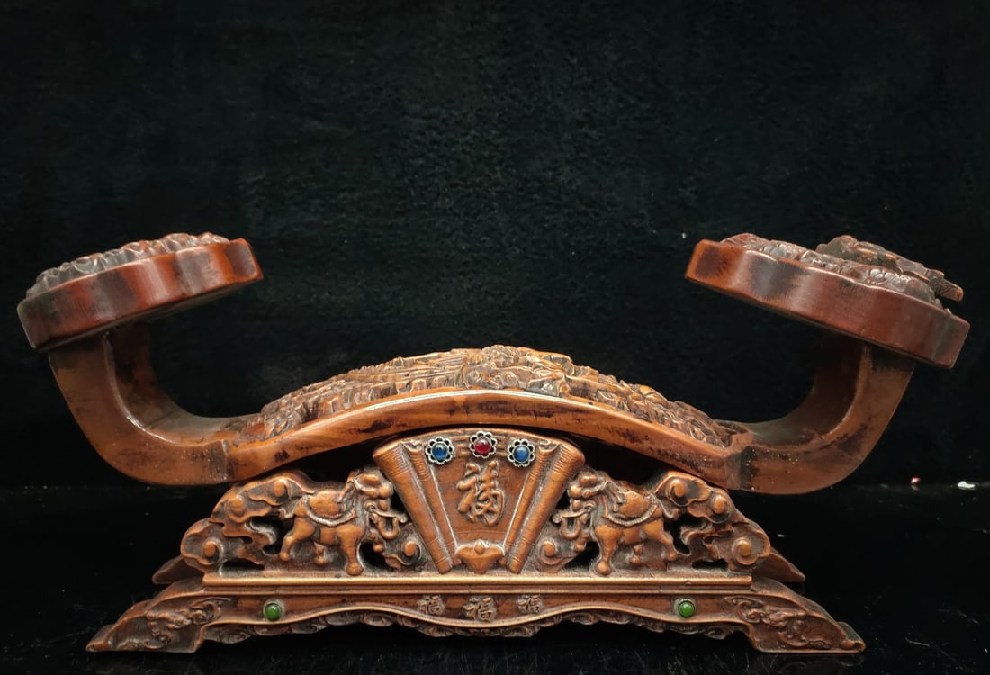 A treasured rosewood ruyi (scepter) with dragon and phoenix design. (1 of 8)