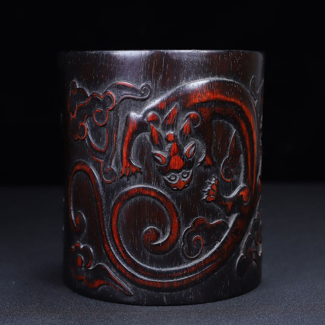 Collector's Choice Rosewood Carved Dragon Round Pen Holder: A rare rosewood carved round brush holder featuring a dragon symbolizing good fortune, 13.5 cm in diameter and 15 cm in height. Provenance:From a noted private collection in Bavaria, Germany. Our coop