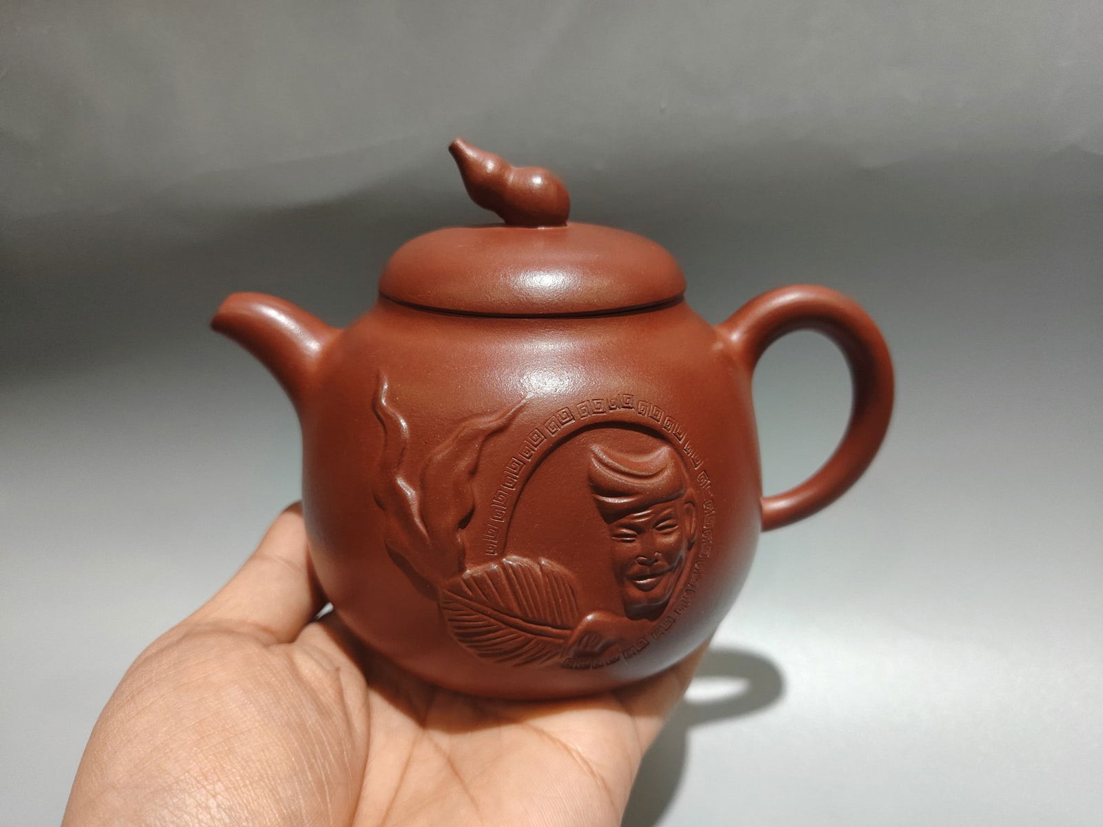 Name: Ji Gong Pot: Name: Ji Gong Teapot (Lower Style) Author: Yuan Xiaoqiang Size: 15 x 11 cm Capacity: 380cc Clay: Original Red Clay Provenance:Private collection from a professor in ESC Rennes School of Business. Our