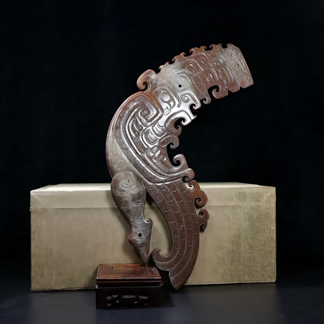 Exquisite antique piece, a large-scale Hetian jade ornament with full infiltration of black birds: Exquisite piece from a private collection. A large piece of Hetian jade, unearthed and fully inlaid with a black bird motif. The patina is thick and deep, the color penetrating to the bone. The