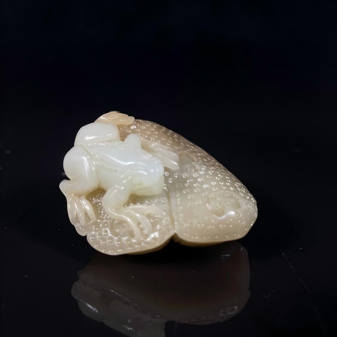 Treasured Hetian jade pebble hand-held piece: This is a collectible Hetian jade pebble hand-carved piece. Dimensions: 4.5 x 4 cm, Weight: 53.5 g Provenance:Private collection, Warsaw , Poland. Our cooperative logistics services provider expertly