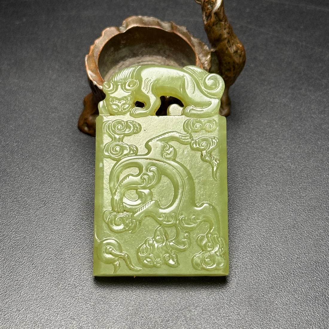 Old Yellow Jade Dragon and Phoenix Pattern Pendant: The old yellow jade dragon and phoenix patterned plaque is rectangular in shape. The top is carved with a mythical beast (Pixiu/Chihu) in openwork, forming a hole for the cord ?C a classic design in t