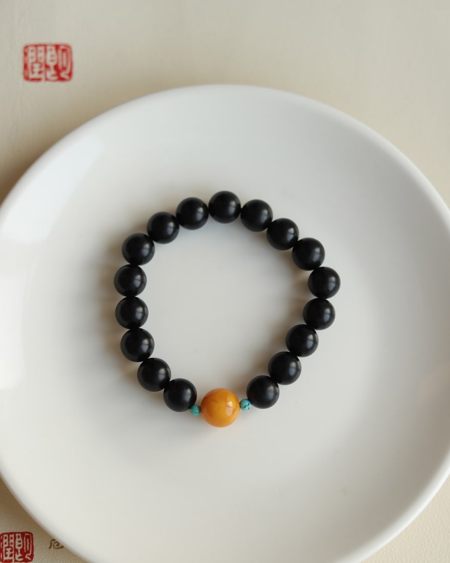 Natural black jade bracelet: This natural black jade bracelet is approximately 10mm in size and features natural raw turquoise and antique wax beads. Its simple yet elegant design makes it suitable for both men and women. Provena