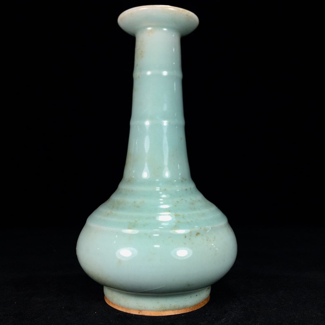 A Song Dynasty Longquan porcelain vase with a patina developed over time. (1 of 9)