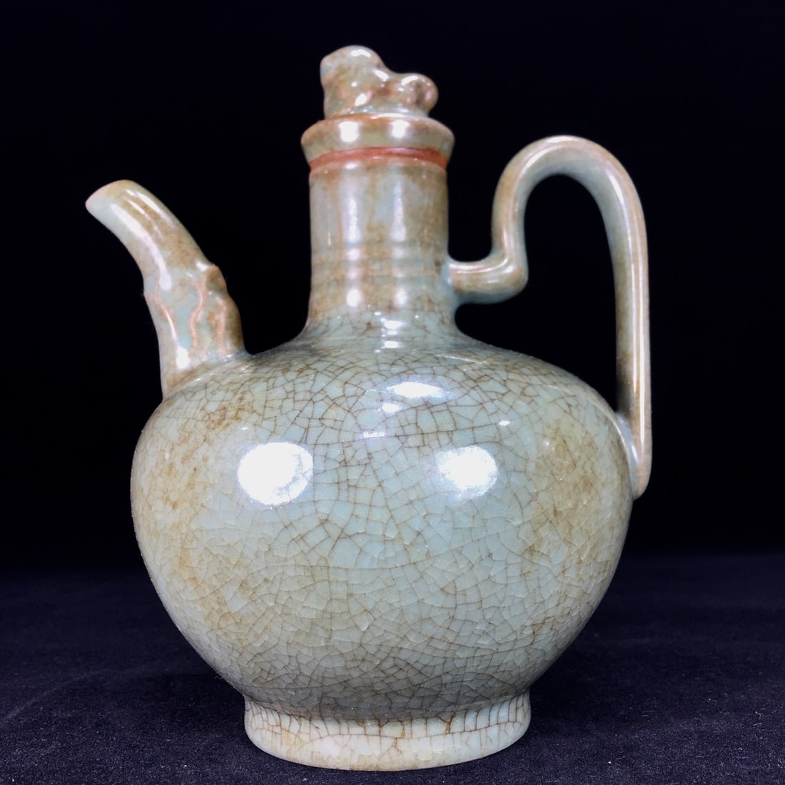 A Song Dynasty Ru ware wine pot with a patina that has been passed down through generations. (1 of 9)