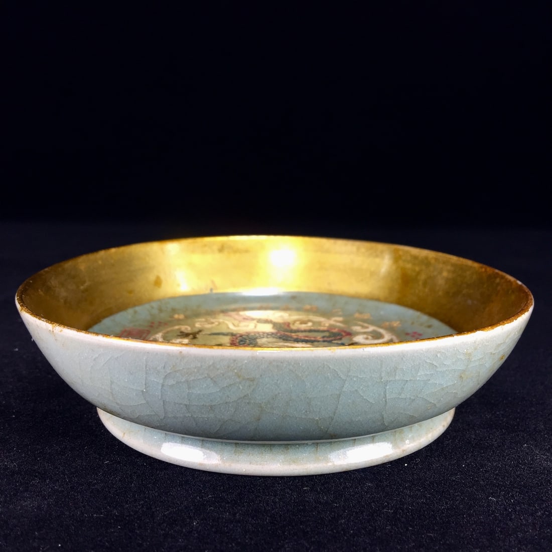 A Song Dynasty Ru ware gilded dragon-patterned round washer with a rich patina. (1 of 9)