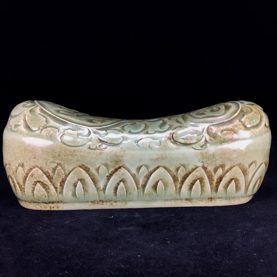 A Song Dynasty Yaozhou porcelain pillow with a beautiful patina.: A Song Dynasty Yaozhou porcelain pillow with a beautiful patina, measuring 26 x 10.5 cm. Provenance:An old private collection in Scotland, United Kingdom. Private collection in Paris, acquired from th