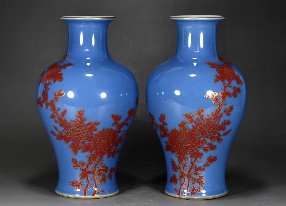 A blue-glazed, gilt-black Guanyin vase with chrysanthemum and poem design in the Qianlong period of: A blue-glazed, gilt-black Guanyin vase with chrysanthemum and poem design in the Qianlong period of the Qing Dynasty, 25 cm high and 15 cm in diameter. Provenance:Private collection from a professor i