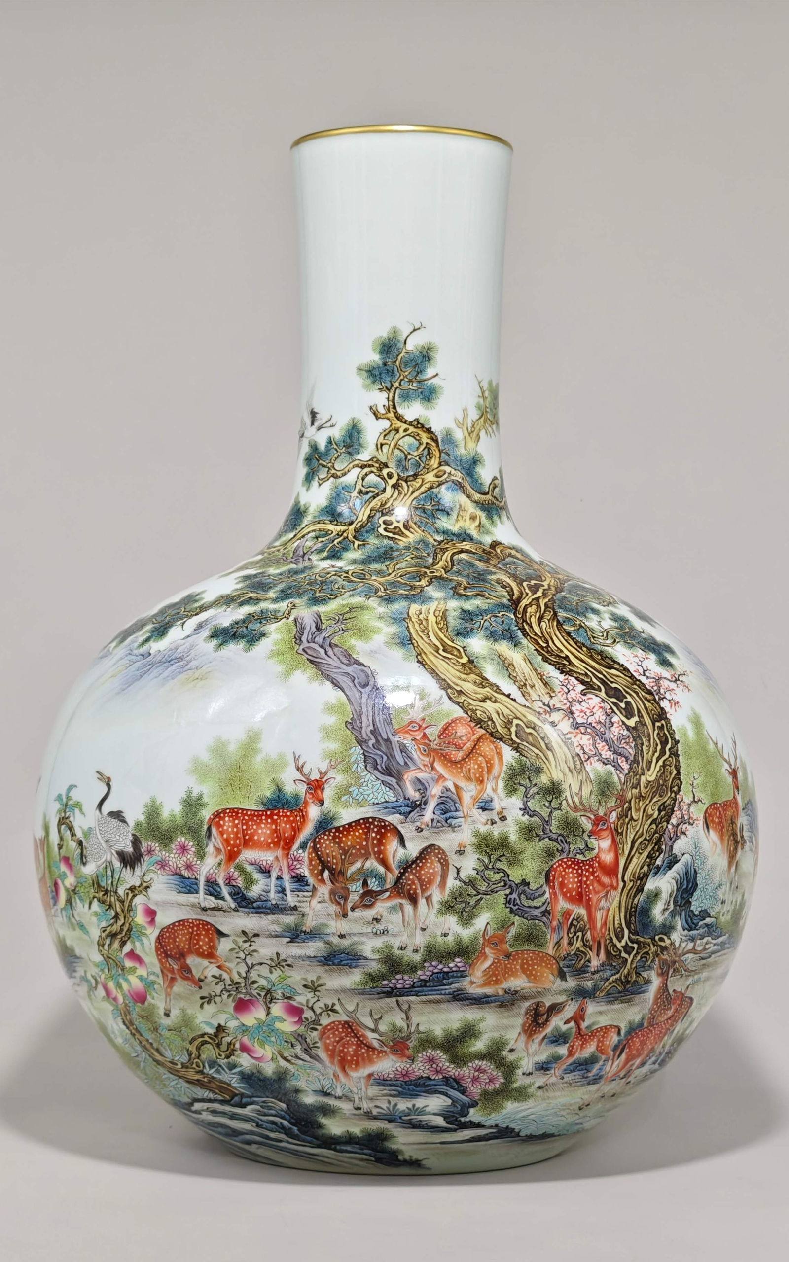 A famille rose celestial globe vase with deer and crane design, bearing the mark of the Qianlong (1 of 9)