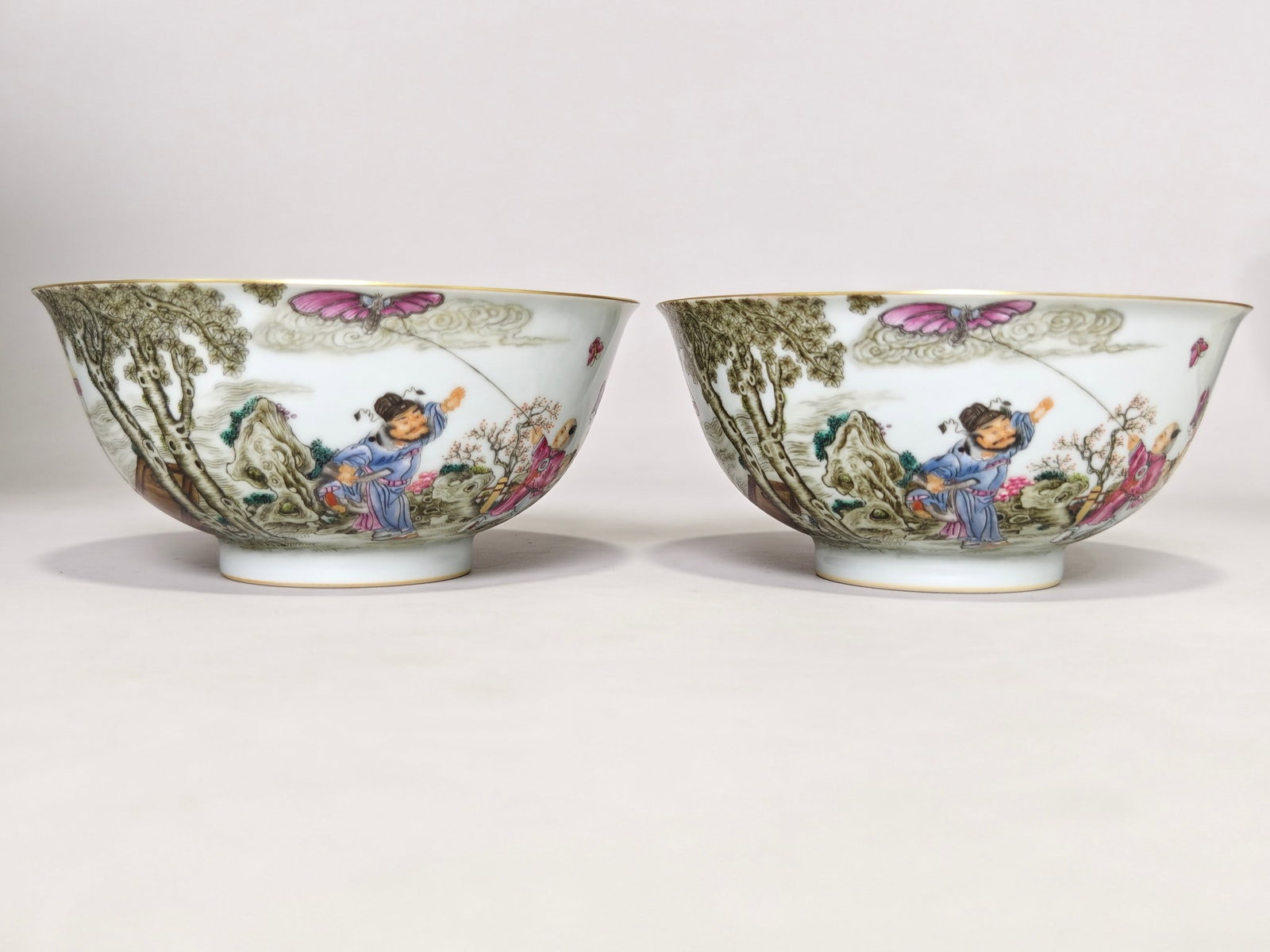 A blue and white porcelain bowl with a dragon motif and famille rose decoration of ladies with (1 of 9)