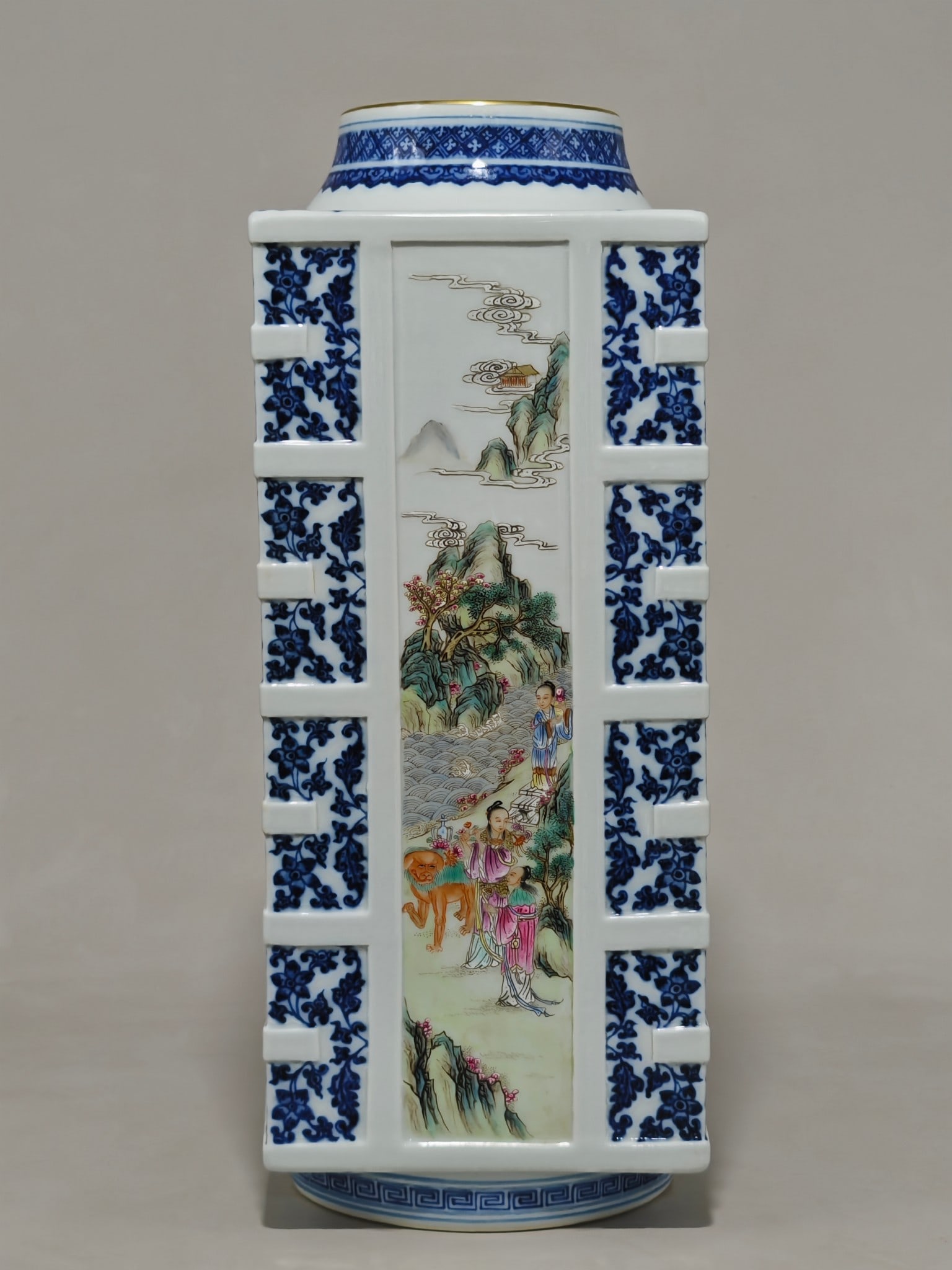 A blue and white porcelain vase with a lotus scroll design and a windowed design depicting Magu (1 of 10)