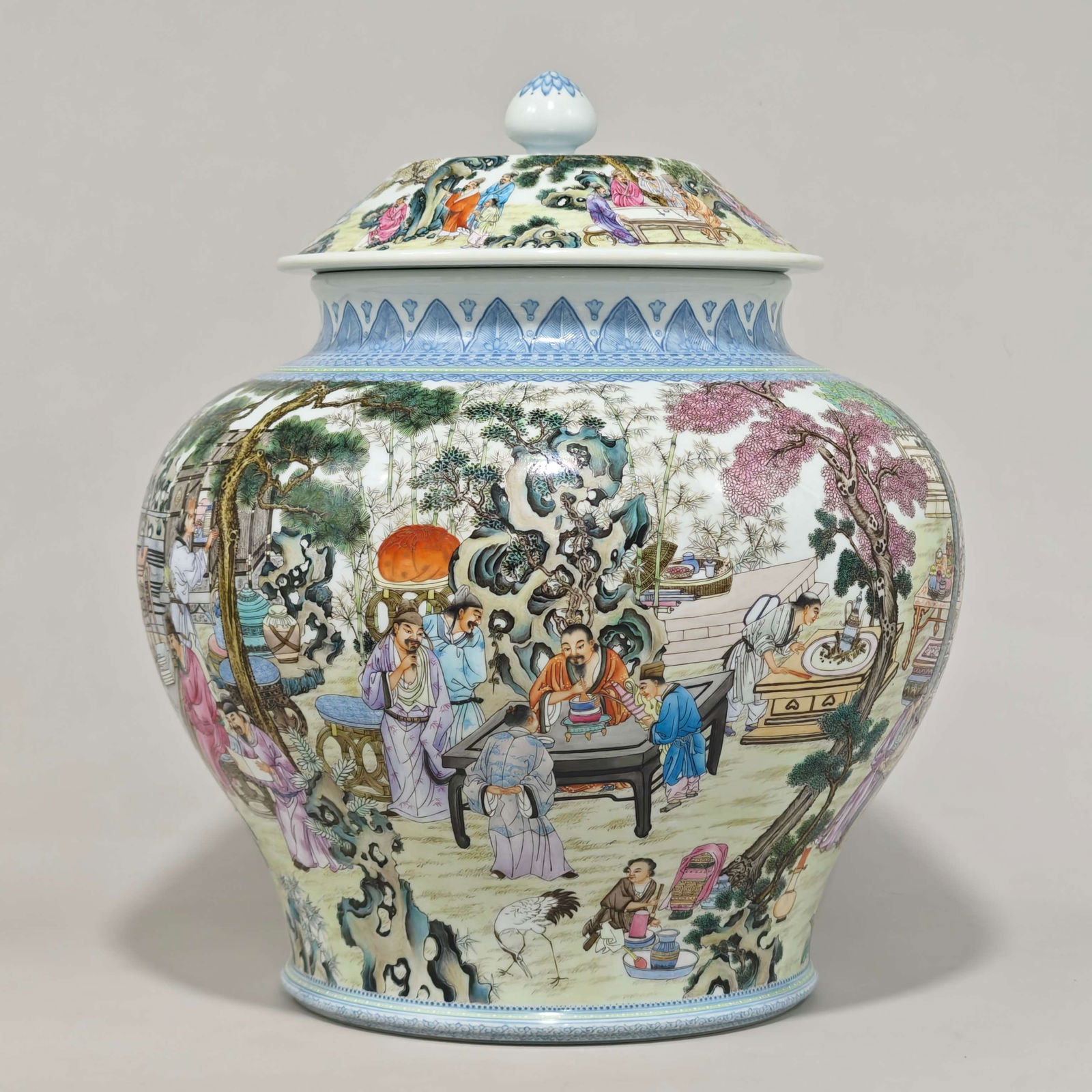A covered jar with enamel decoration depicting the elegant Western Garden scene, made by Emperor: A covered enamel jar with a Western Garden scene, bearing the mark of Emperor Qianlong of the Qing Dynasty. Height: 36 cm, Diameter: 32 cm. Provenance:Private collection from a professor in ESC