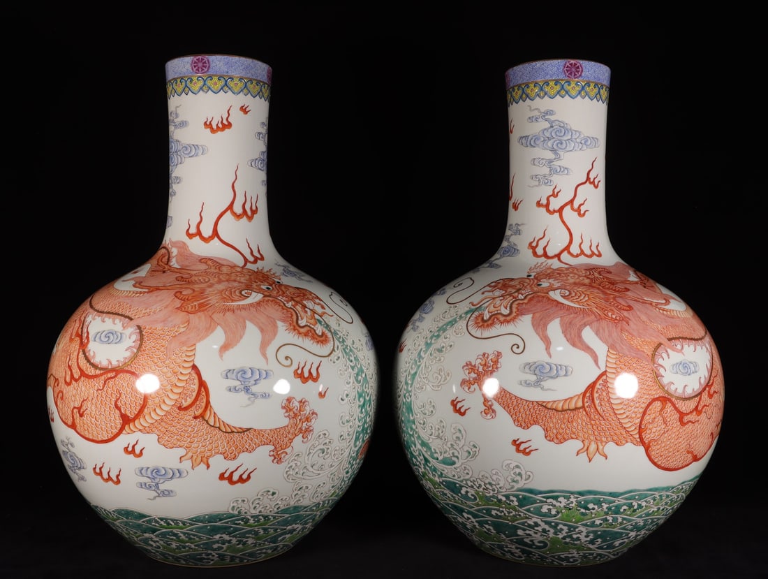 A famille rose and iron-red dragon-and-son celestial globe vase bearing the mark of the Yongzheng: A famille rose vase with the mark of the Yongzheng reign of the Qing Dynasty, featuring a dragon and son painted in iron red enamel. Dimensions: Height 58cm, Mouth Diameter 12.8cm, Belly Diameter