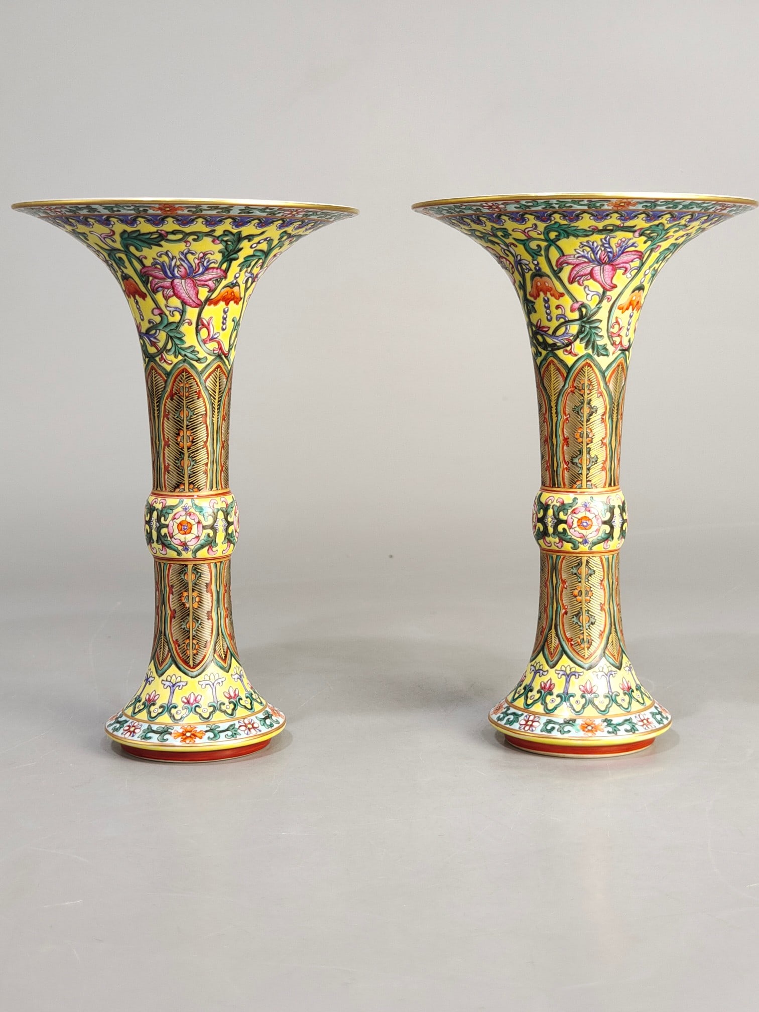 A famille rose enamel painting with a yellow ground and lotus and mushroom motif, dating to the: Height 20.5 cm, mouth diameter 13 cm, Qing Dynasty Qianlong period famille rose yellow ground lotus scroll mushroom. Provenance:Private collection from a professor in Heidelberg University. Our