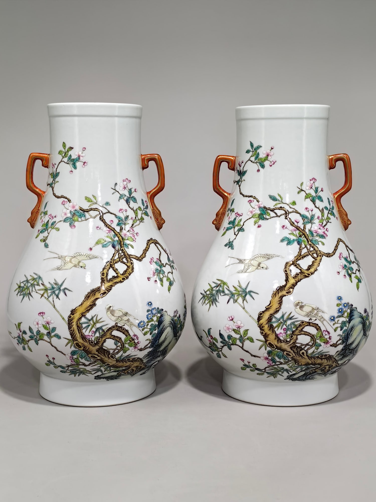 A Qing Dynasty Yongzheng period enamel-painted vase with oriole and floral design and two handles.: A Qing Dynasty Yongzheng period enamel-painted vase with oriole and floral design, measuring 31 cm in height and 21 cm in diameter. Provenance:Private collection, Geneva, Switzerland. Our cooperative