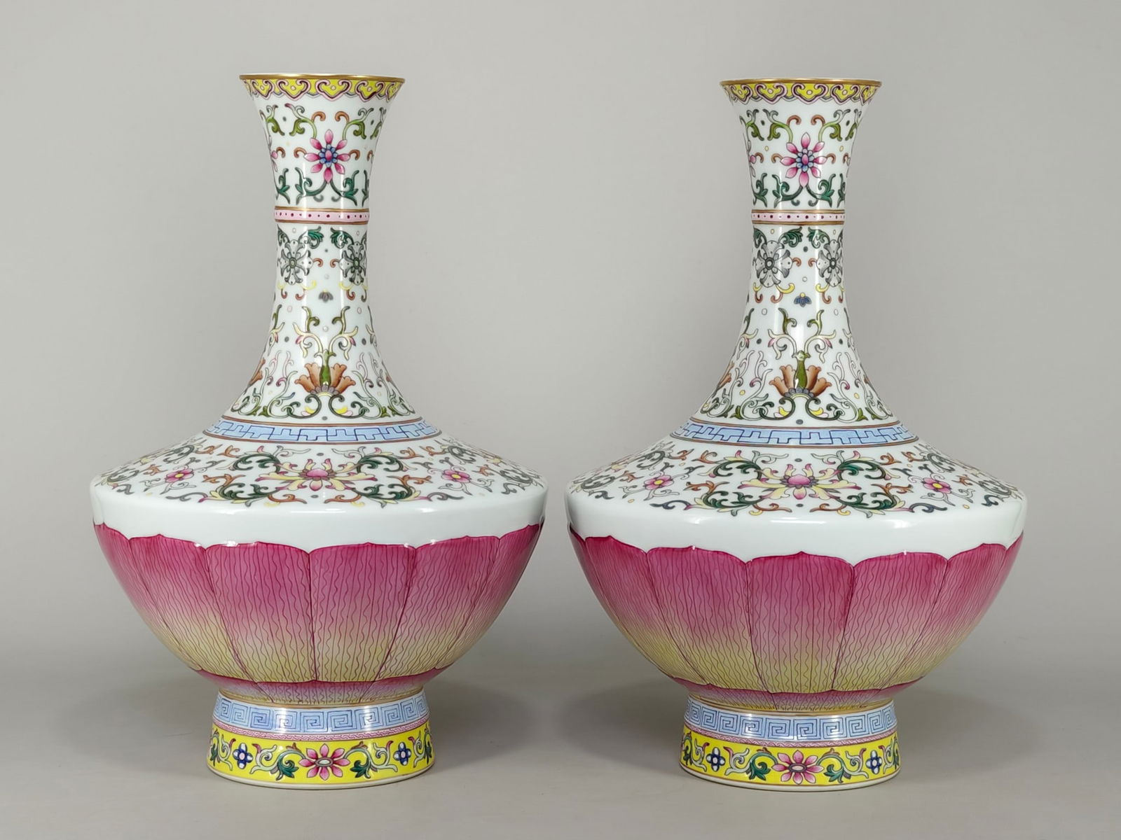 A square-shouldered famille rose vase with lotus scroll design, bearing the mark of the Qianlong: A square-shouldered vase with a lotus scroll design, measuring 32.5 cm in height and 22 cm in diameter, bearing the mark of the Qianlong period of the Qing Dynasty. Provenance:Private collection,