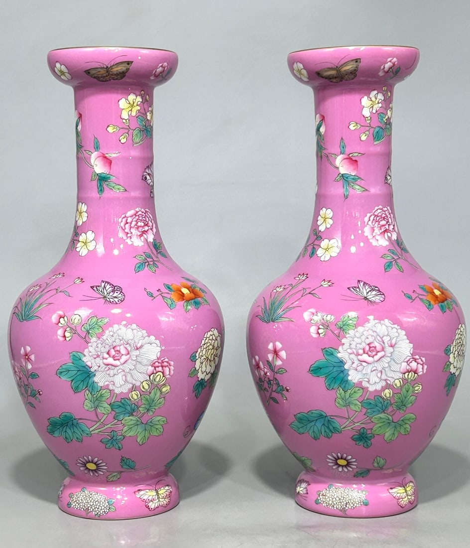 A Qianlong period (1736-1745) famille rose vase with a pink background and a butterfly and flower: Height 33.2 cm, diameter 15.5 cm, Qing Dynasty Qianlong period famille rose palace-style vase with butterfly and flower design. Provenance:Private collection, Geneva, Switzerland. Our cooperative