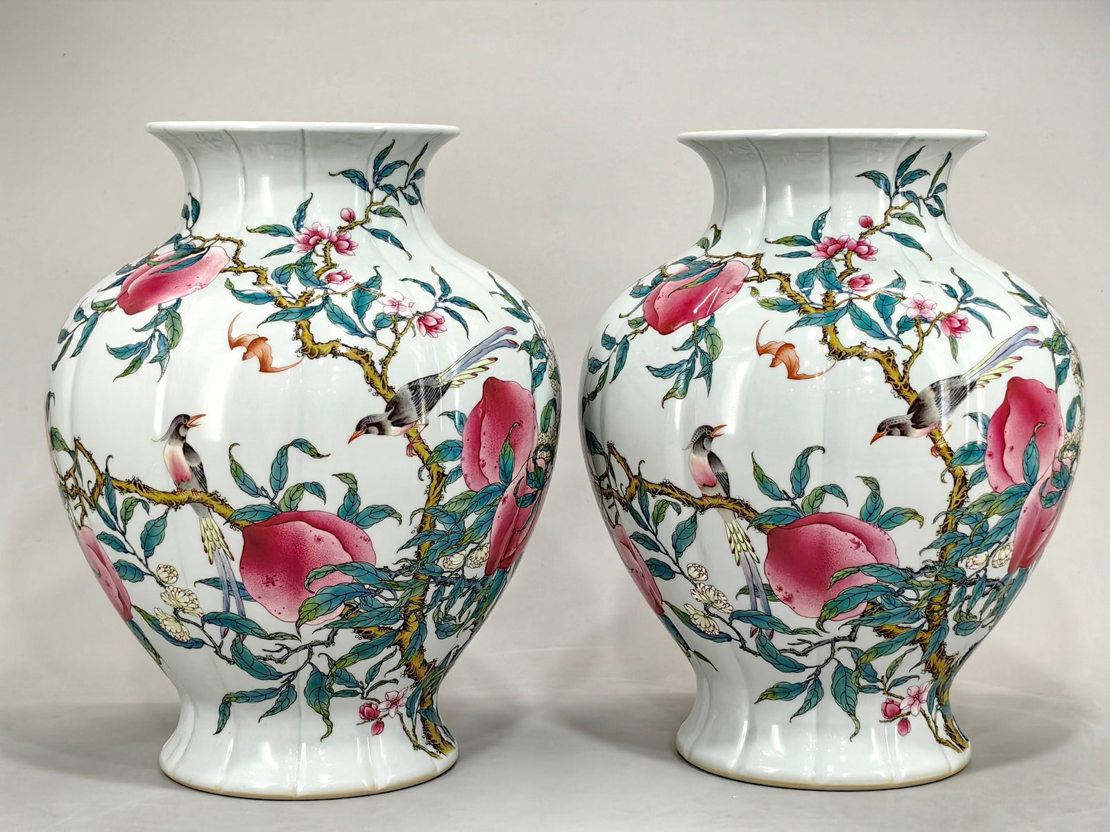 A Qing Dynasty Yongzheng period enamel-painted vase with ribbon bird and peach design.: A Qing Dynasty Yongzheng period enamel-painted vase with a ribbon bird and peach design, measuring 33 cm in height and 27 cm in diameter. Provenance:Private collection, Geneva, Switzerland. Our