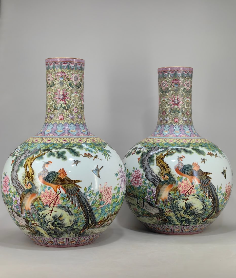 A Qing Dynasty Qianlong period enamel-painted celestial globe vase with a design of lotus scrolls,: A celestial globe vase with a design of lotus scrolls, open windows, and a hundred birds paying homage to the phoenix, bearing the mark of the Qianlong period of the Qing Dynasty. It measures 55 cm