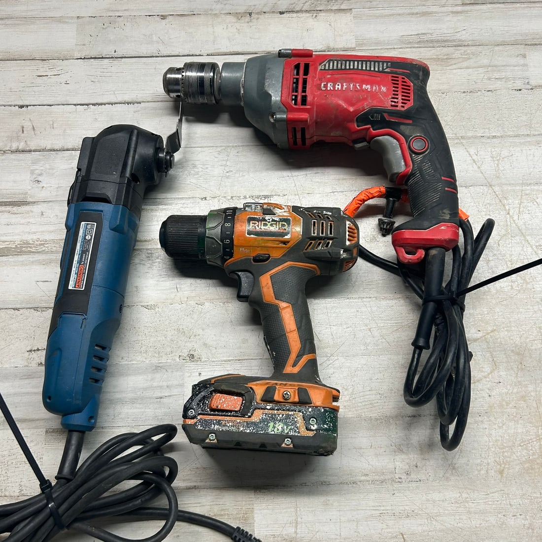 Mixed Power Tool Lot Including Ridgid Cordless Drill, Craftsman Corded Drill, and Hercules (1 of 5)
