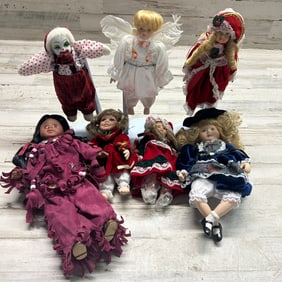 Group of Eight Holiday-Themed Porcelain & Collector Dolls, Including Angel and Clown