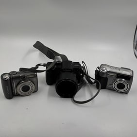 Group of Three Digital Cameras: Canon PowerShot A590 IS, Panasonic Lumix DMC-FZ5, and Kodak