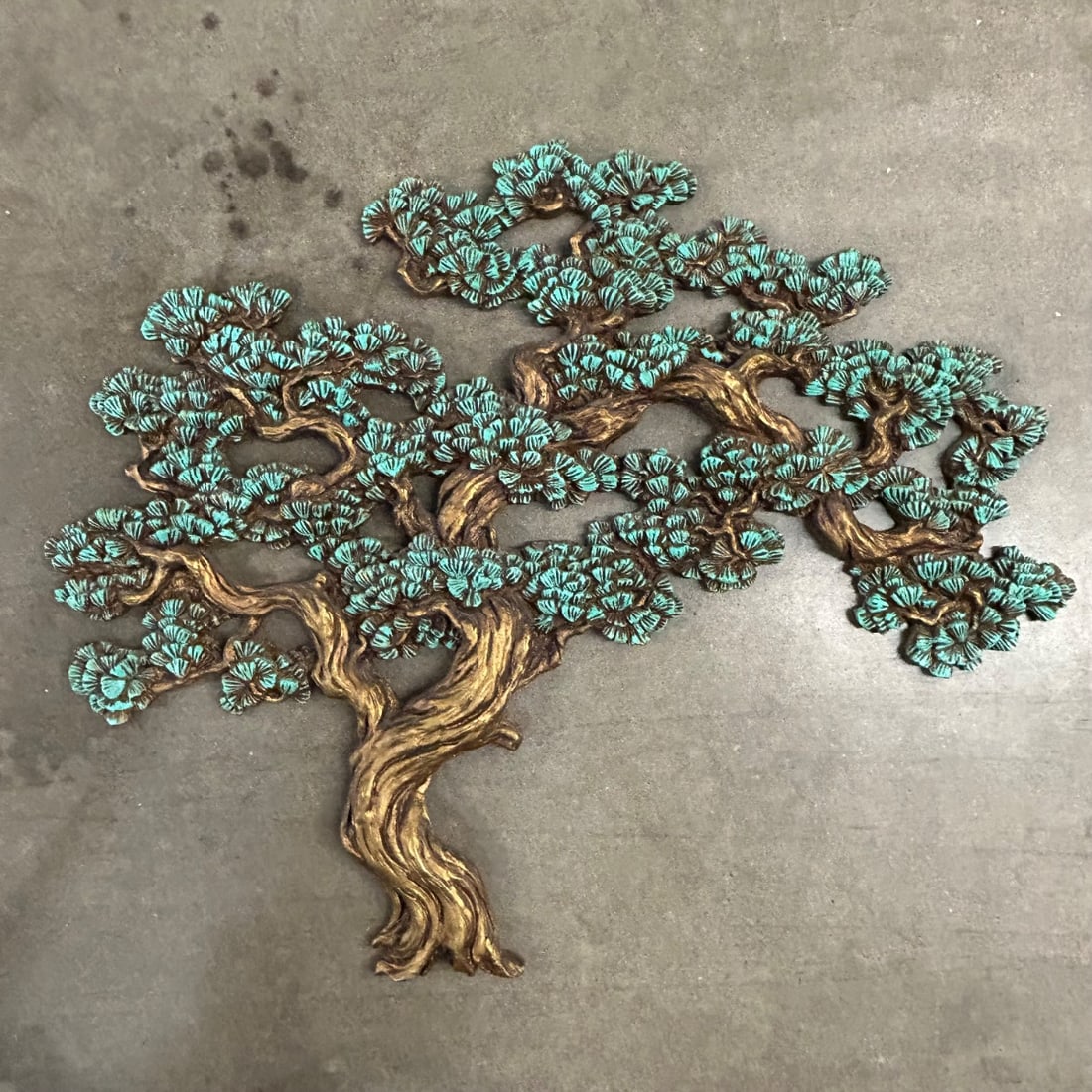 Vintage Hand Carved Wood Tree Wall Art Sculpture Teal & Gold Finish Mid Century Modern: This striking vintage wall art sculpture depicts a stylized tree with a rich, textured trunk and branches finished in a lustrous gold tone. The foliage is rendered in a vibrant teal color, creating a