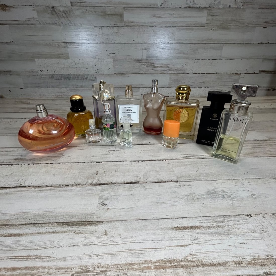 Designer Fragrance Collection - Calvin Klein Eternity, Burberry, Tommy Hilfiger, YSL Paris LOT: This collection features a variety of designer and popular fragrances for women, presented in their original bottles. Notable scents include Calvin Klein Eternity, Burberry Goddess, Tommy Hilfiger, an