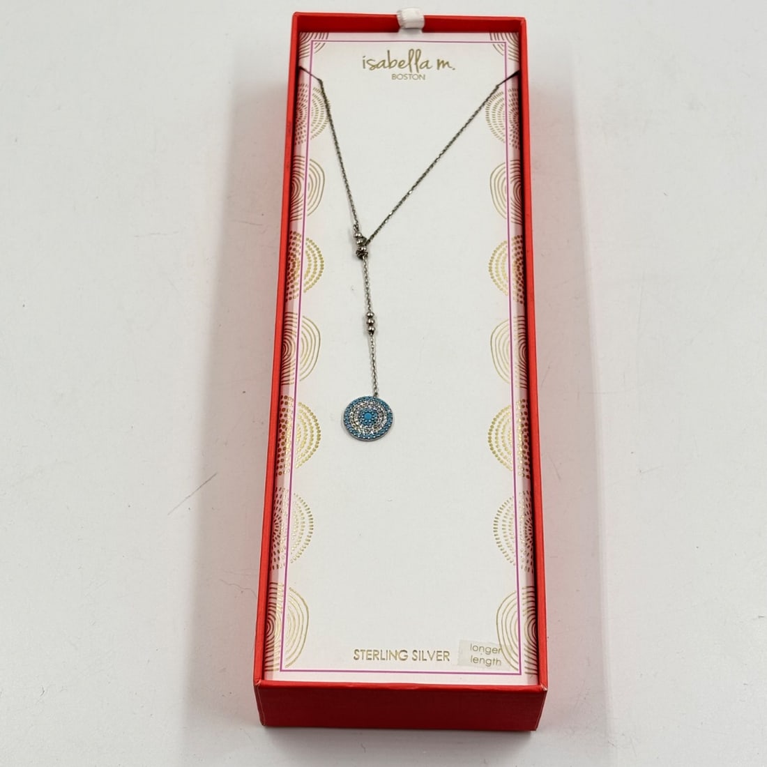 Isabella M. Boston Sterling Silver Turquoise & CZ Lariat Necklace: This elegant Isabella M. Boston sterling silver lariat necklace features a central circular pendant adorned with sparkling cubic zirconia stones and vibrant turquoise accents. The chain is designed fo
