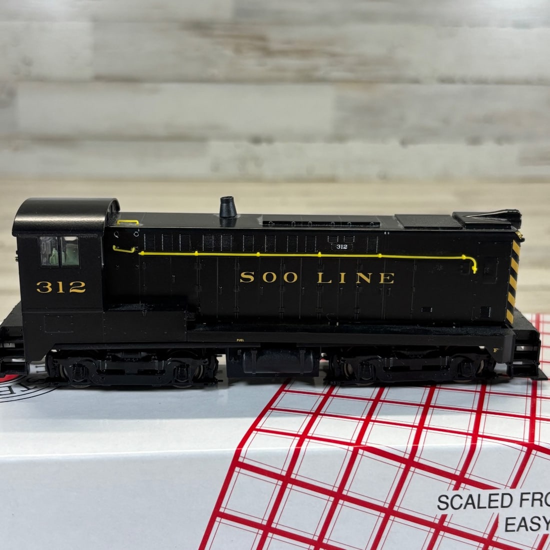 Stewart Hobbies HO Scale Baldwin DS-4-4-1000 Soo Line #312 Model Train Kit: This is a Stewart Hobbies HO Scale model train kit, specifically a Baldwin DS-4-4-1000 locomotive painted for the Soo Line Railroad, road number 312. The model appears to be assembled and is presented