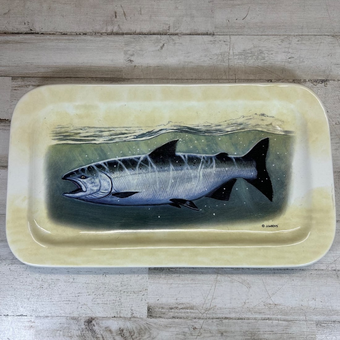 J. Wiens Signed Salmon Fish Ceramic Rectangular Serving Platter Dish China: This charming rectangular ceramic serving platter features a beautifully rendered painting of a salmon swimming underwater, signed "J. Wiens." The artwork is set against a subtle, textured background