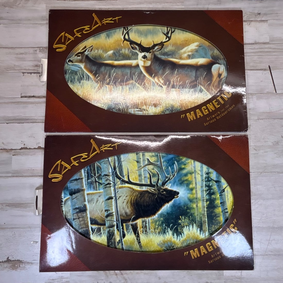 Safe-T-Art "Magnetic" Wildlife Art Decal Pair - Deer & Elk Scenes: This listing features a pair of Safe-T-Art "Magnetic" wildlife art decals, perfect for enthusiasts of hunting and nature scenes. The first decal depicts two deer in a grassy meadow with rocky outcrops
