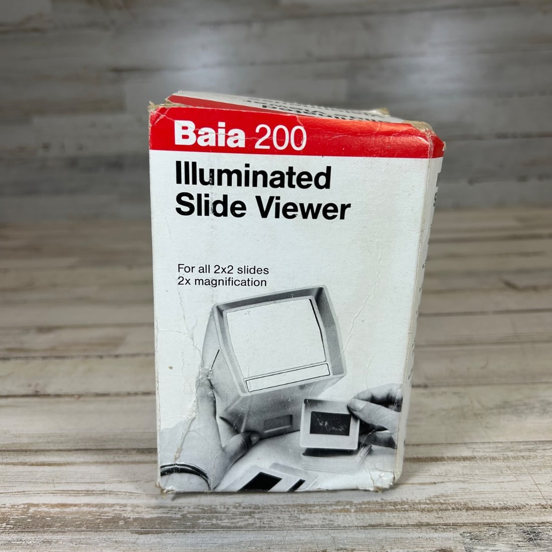 Baia 200 Illuminated Slide Viewer 2x Magnification Original Box & Instructions: This is a vintage Baia 200 Illuminated Slide Viewer, designed for viewing standard 2x2 inch slides with 2x magnification. The viewer comes with its original box and instruction manual, offering a comp