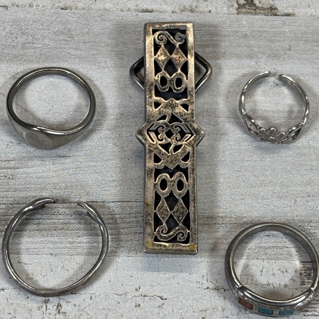 Sterling Silver Lot: 5 Rings, 1 Pendant/Bale - Mexican, Turquoise Inlay: This collection features five distinct sterling silver rings and one ornate pendant or bale. The lot includes a signet ring with an "A" initial, a ring with inlaid red and turquoise stones, a floral m