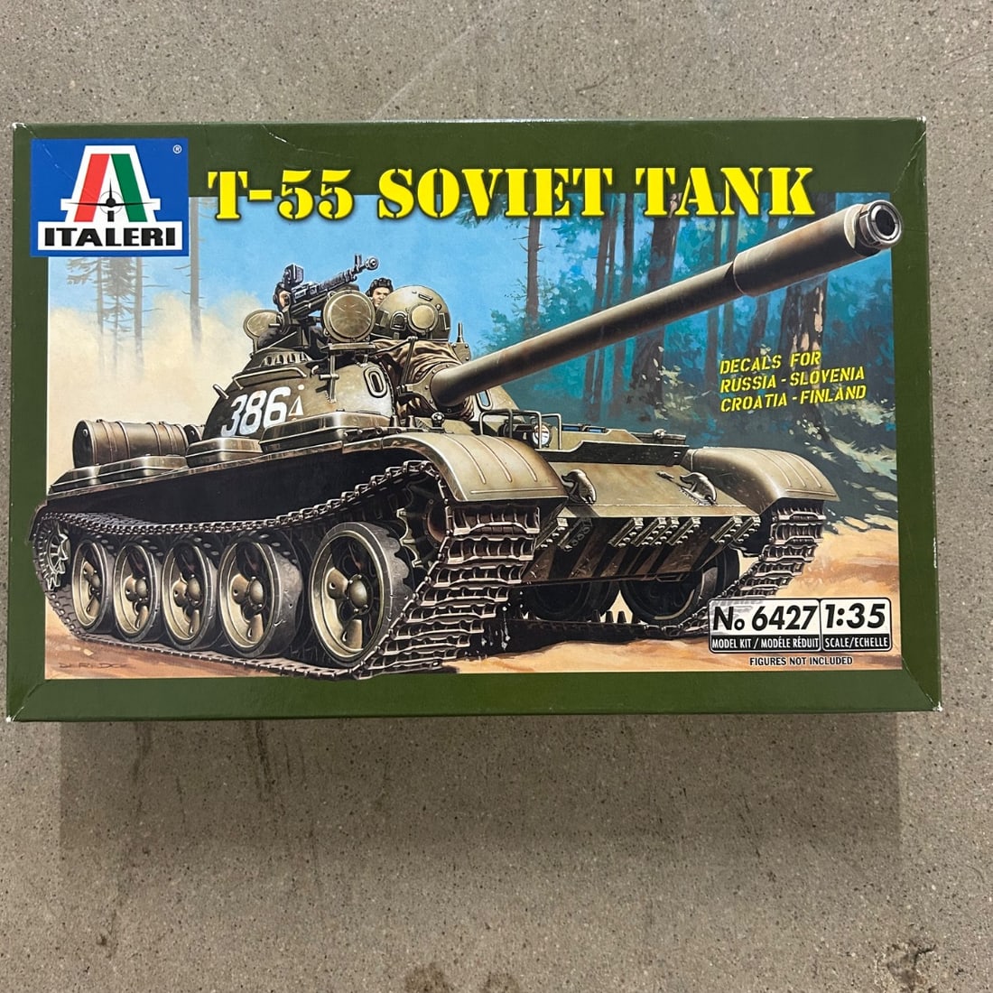 Italeri T-55 Soviet Tank Model Kit - 1:35 Scale - No. 6427: This is a 1:35 scale plastic model kit of the T-55 Soviet Tank, manufactured by Italeri. The kit includes parts for the tank and decals for various nations including Russia, Slovenia, Croatia, and Fin