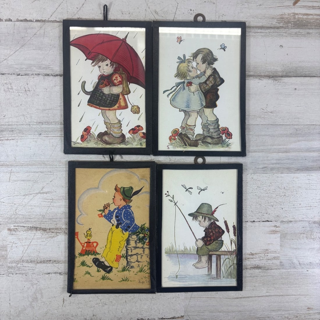 Set of 4 Vintage Hummel Style Children's Prints, Framed, Charming Scenes: This charming collection features a set of four vintage prints, each depicting adorable children in idyllic scenes. The prints appear to be in the style of Berta Hummel, with a focus on innocence and