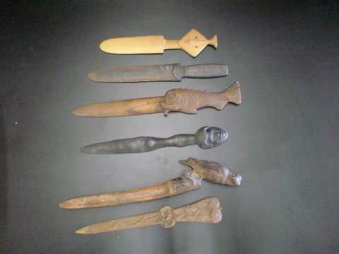 set of 6 wooden carved library knives: set of 6 wooden carved library knives, 1) flowers and vines on handle, 2) and 3), native head carvings, 4) a fish, 5) intricate fine metal designed carved in knife and handle base, and 6) elaborately