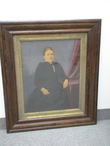Oil portrait of woman, intricately carved frame 