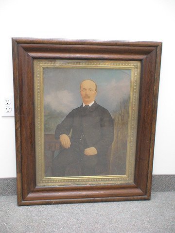 Oil portrait of man, intricately carved frame