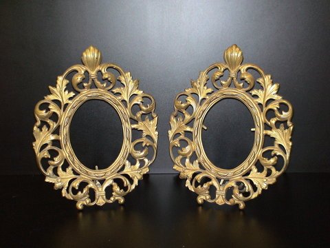 Two heavy metal gold plated oval picture frames: Two heavy metal gold plated oval picture frames, stand folds out, 8x11,