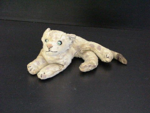 Old stuffed lion with green eyes, some wear on fu: Old stuffed lion with green eyes, some wear on fur 11" long.