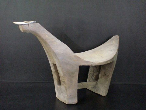 Unique shaped stool with old abalone shell tied o: Unique shaped stool with old abalone shell tied on top part, 26" long, 18" high.